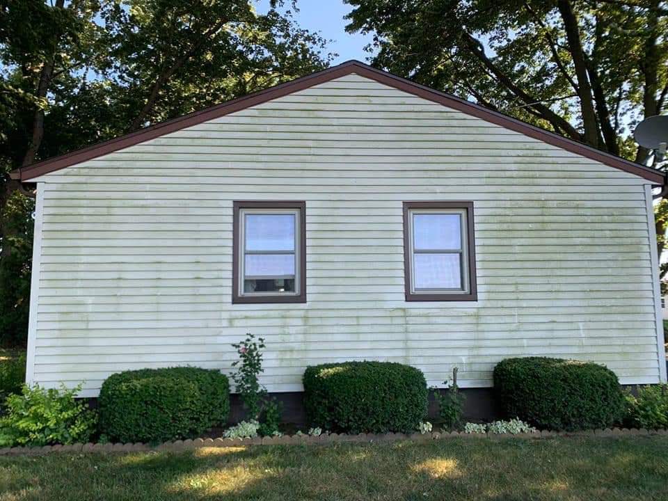 This is a picture of a homes siding in Beverly neighborhood of Chicago Illinois before being cleaned by Chicago property detailing and pressure washing.